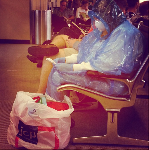 RT Lady just chilling at Dulles in her homemade Hazmat suit  - embedded image 